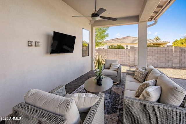 view of patio / terrace featuring ceiling fan and an outdoor living space