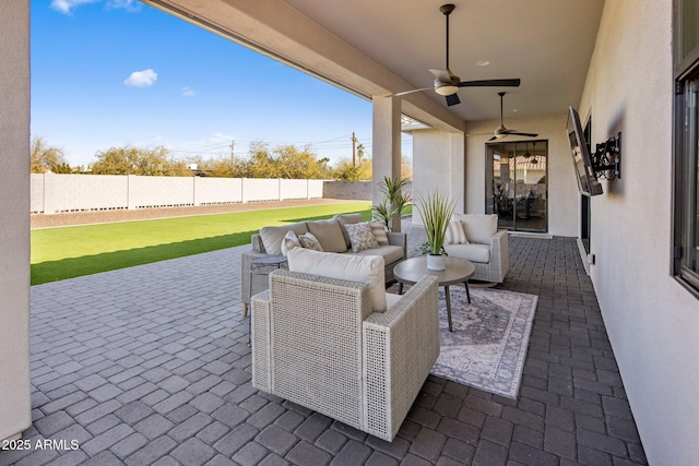 view of patio / terrace featuring ceiling fan