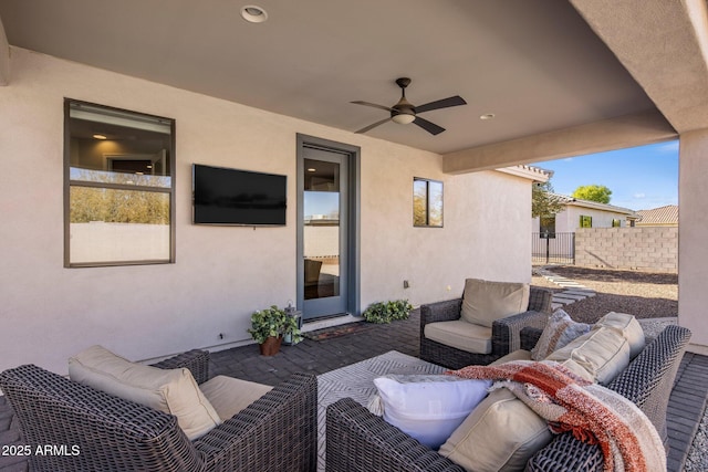 view of patio featuring an outdoor hangout area and ceiling fan