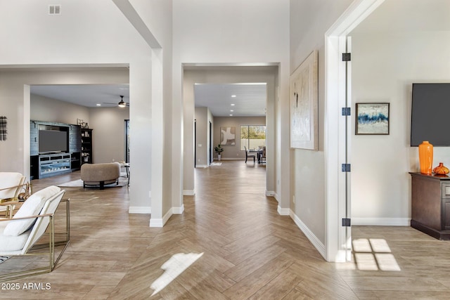 corridor with light parquet floors