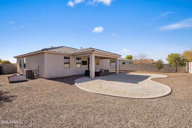 rear view of property with a patio and central air condition unit