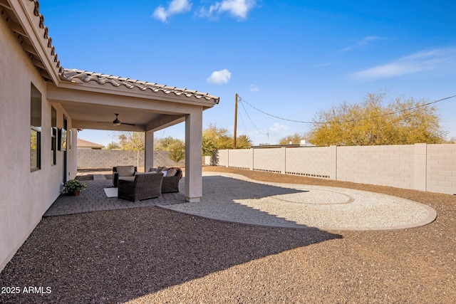 view of yard with a patio area and ceiling fan