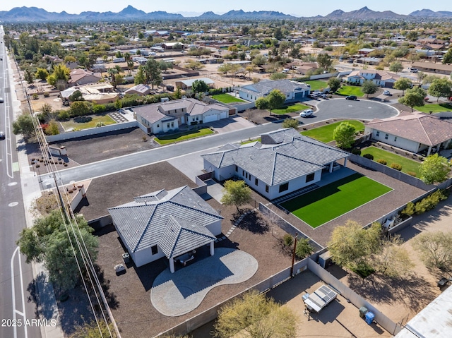 birds eye view of property featuring a mountain view