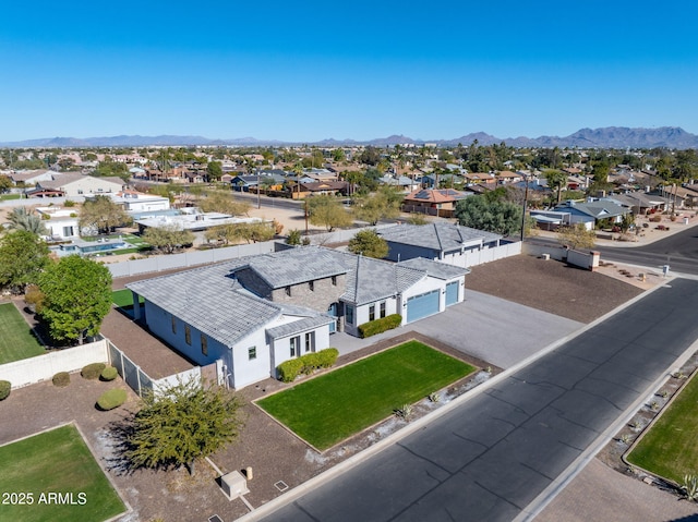 birds eye view of property with a mountain view