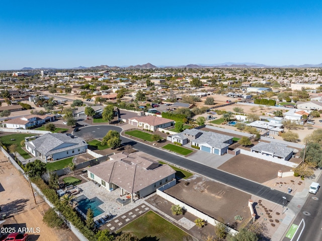 birds eye view of property with a mountain view