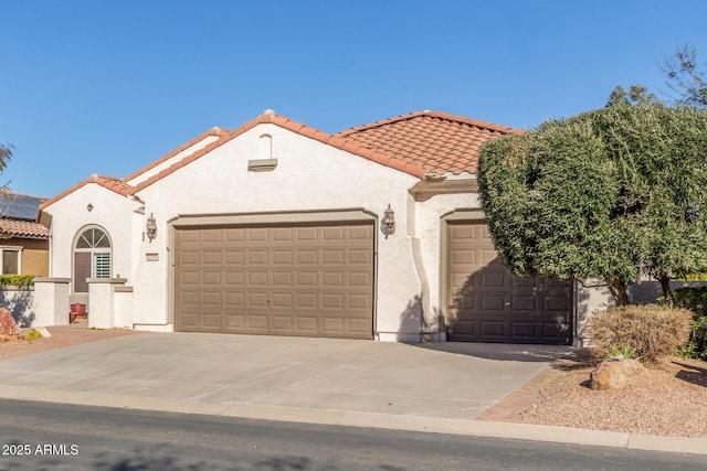 mediterranean / spanish-style house featuring a garage