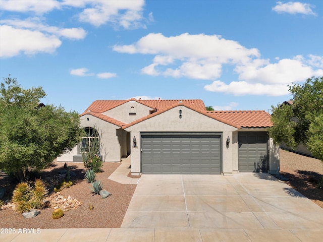 21532 N 262nd Ln, Buckeye, AZ 85396 - mediterranean / spanish-style house featuring a garage, stucco siding, driveway, and a tiled roof