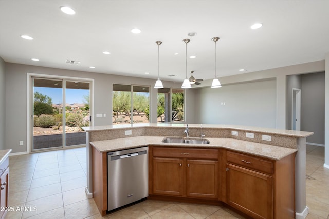 21532 N 262nd Ln, Buckeye, AZ 85396 - kitchen featuring stainless steel dishwasher, a sink, recessed lighting, light tile patterned flooring, and brown cabinetry