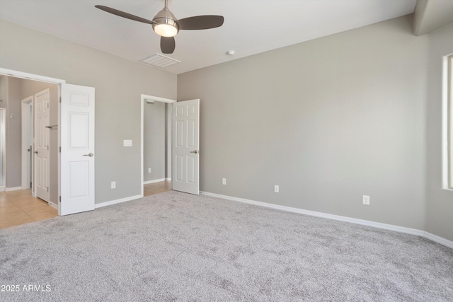 21532 N 262nd Ln, Buckeye, AZ 85396 - unfurnished bedroom with light colored carpet, baseboards, and ceiling fan