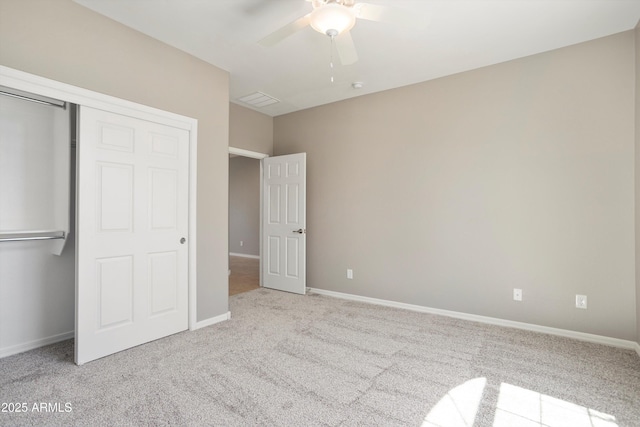 21532 N 262nd Ln, Buckeye, AZ 85396 - unfurnished bedroom featuring carpet, a closet, baseboards, and a ceiling fan