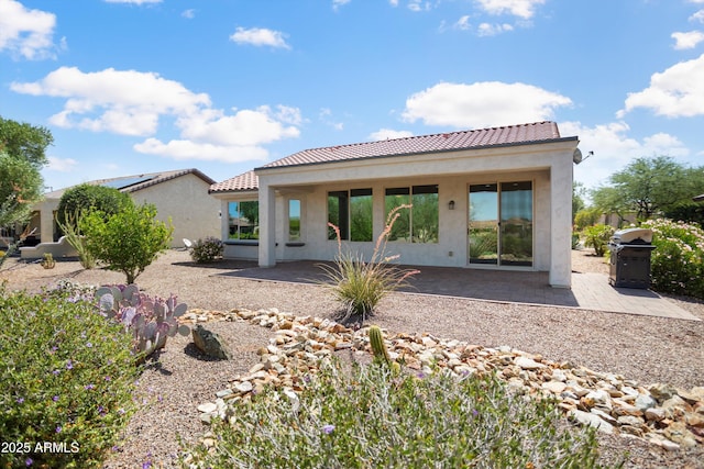 21532 N 262nd Ln, Buckeye, AZ 85396 - rear view of property featuring a patio, stucco siding, and a tiled roof
