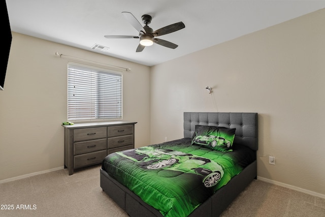 bedroom featuring visible vents, a ceiling fan, baseboards, and light colored carpet