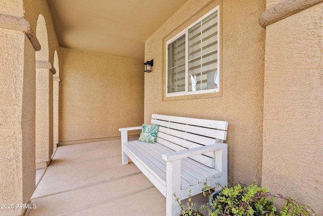entrance to property with stucco siding