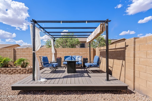 deck with a pergola, outdoor lounge area, and a fenced backyard
