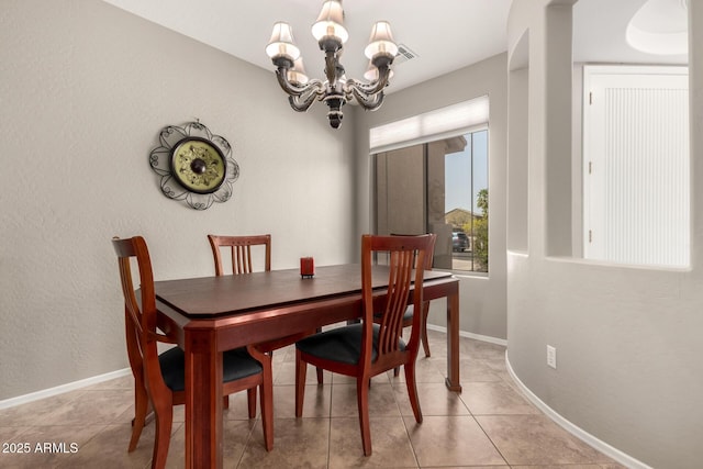 17005 S Coleman St, Phoenix, AZ 85045 - dining space featuring an inviting chandelier, light tile patterned floors, baseboards, and visible vents