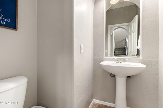 17005 S Coleman St, Phoenix, AZ 85045 - half bath with a textured wall, toilet, and a sink