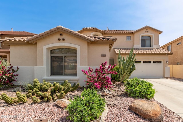 17005 S Coleman St, Phoenix, AZ 85045 - mediterranean / spanish-style home featuring a tile roof, concrete driveway, stucco siding, and a garage