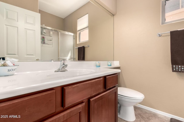 17005 S Coleman St, Phoenix, AZ 85045 - bathroom with vanity, toilet, baseboards, a shower stall, and tile patterned floors