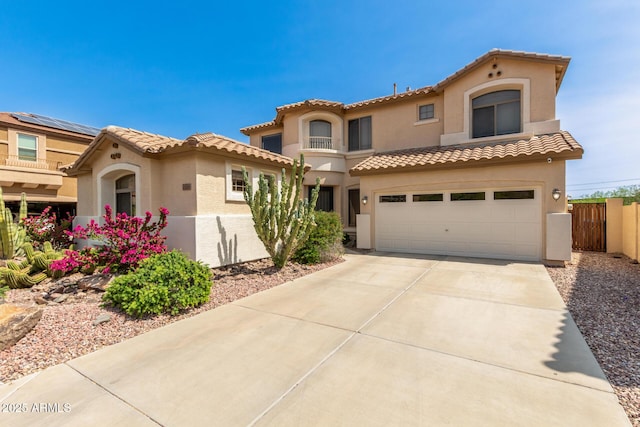 17005 S Coleman St, Phoenix, AZ 85045 - mediterranean / spanish-style home featuring fence, stucco siding, a tiled roof, and concrete driveway