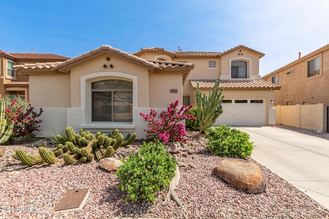 17005 S Coleman St, Phoenix, AZ 85045 - mediterranean / spanish-style house featuring driveway, a garage, a tiled roof, and stucco siding