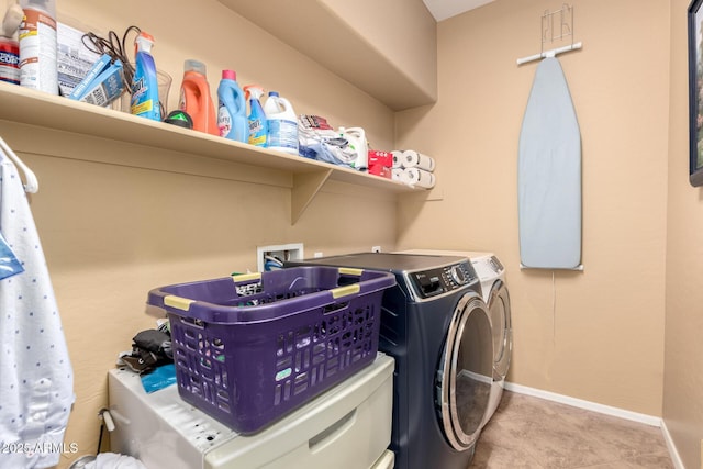 17005 S Coleman St, Phoenix, AZ 85045 - laundry room with tile patterned floors, washing machine and dryer, baseboards, and laundry area
