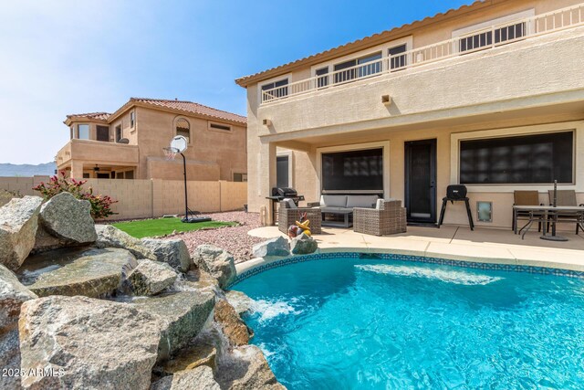 17005 S Coleman St, Phoenix, AZ 85045 - view of swimming pool featuring a patio area, fence, outdoor lounge area, and a fenced in pool