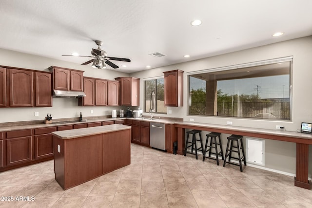 17005 S Coleman St, Phoenix, AZ 85045 - kitchen featuring light countertops, a kitchen island, stainless steel dishwasher, under cabinet range hood, and ceiling fan