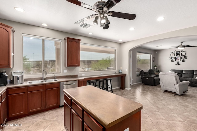 17005 S Coleman St, Phoenix, AZ 85045 - kitchen featuring visible vents, ceiling fan, arched walkways, a sink, and stainless steel dishwasher