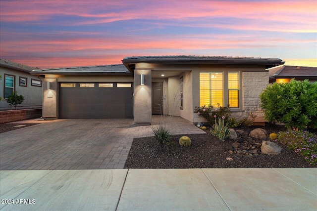 prairie-style home featuring a garage