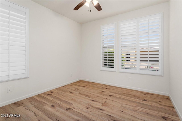 unfurnished room with light hardwood / wood-style flooring and ceiling fan