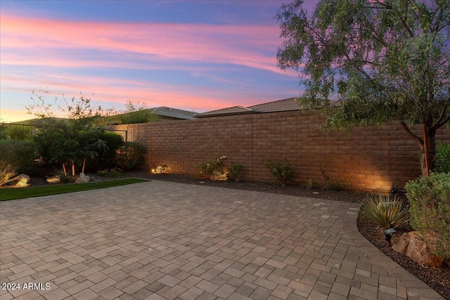 view of patio terrace at dusk