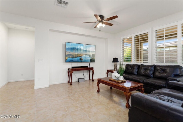 living room featuring ceiling fan and light tile flooring