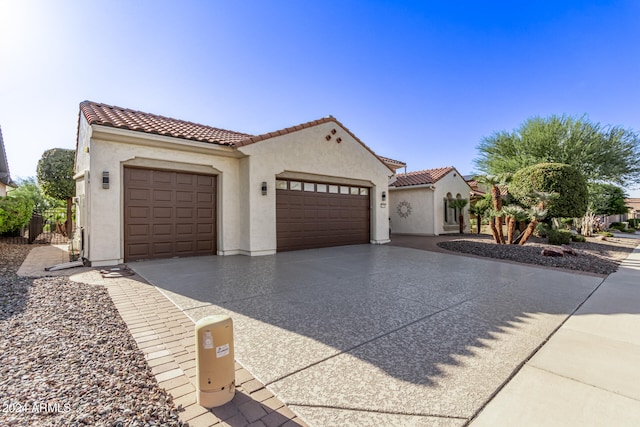 mediterranean / spanish-style house featuring a garage