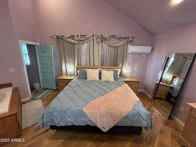 bedroom featuring high vaulted ceiling, a wall unit AC, wood finished floors, and baseboards