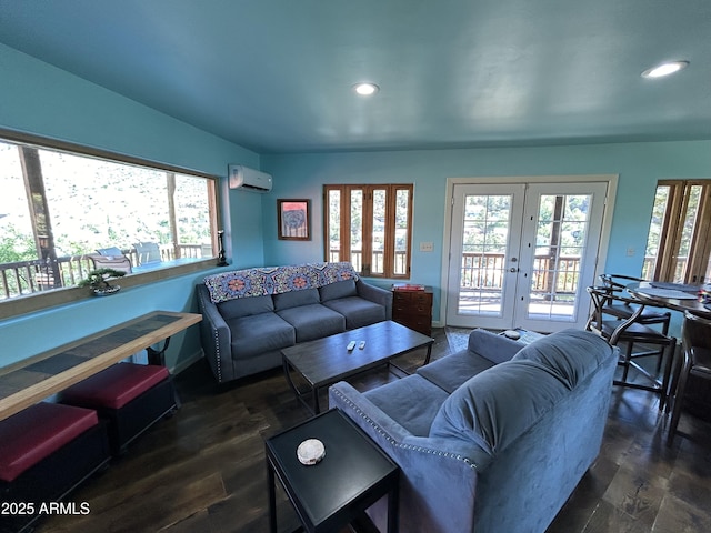 living room with dark wood-style floors, french doors, a wall mounted air conditioner, and recessed lighting