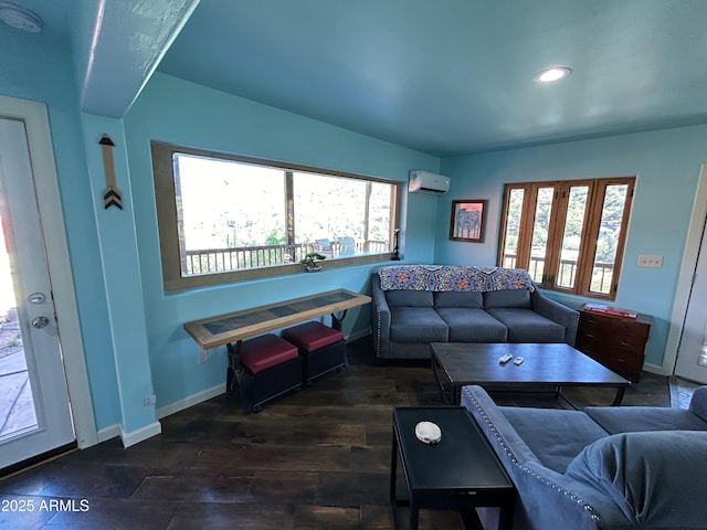 living room featuring a wealth of natural light, baseboards, and wood finished floors