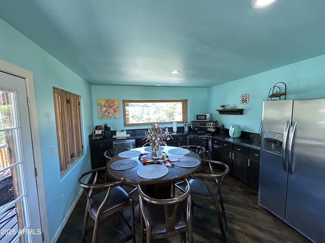 dining area with dark wood-style floors, baseboards, and recessed lighting