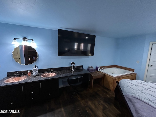 bedroom with dark wood-style floors and a sink