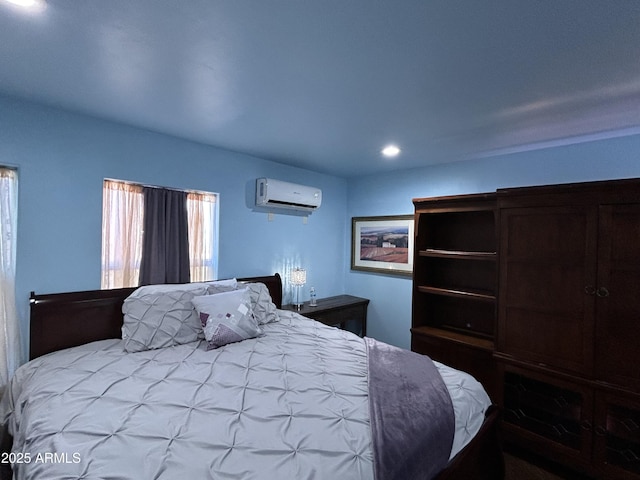 bedroom featuring a wall mounted AC