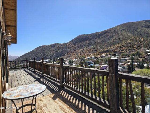 wooden deck featuring a mountain view