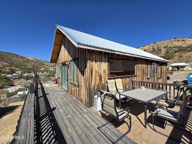 wooden deck featuring a mountain view