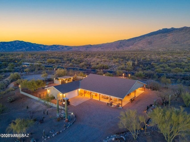 birds eye view of property with a mountain view