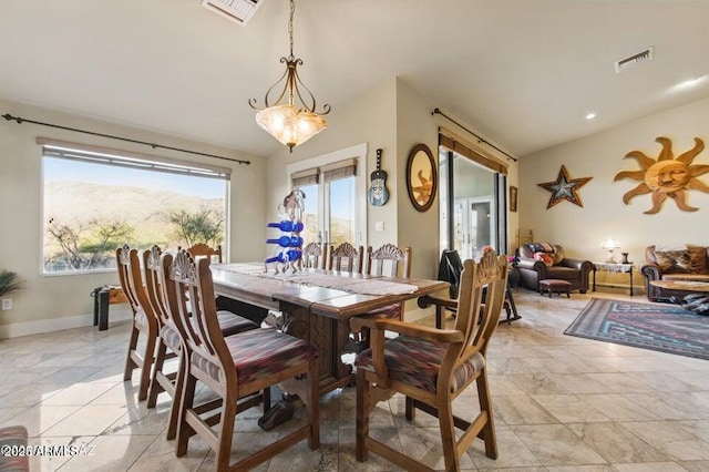 dining area with baseboards and visible vents