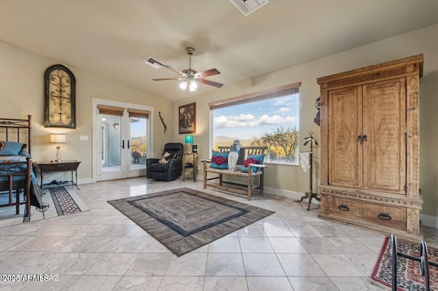 living area featuring baseboards, french doors, visible vents, and ceiling fan