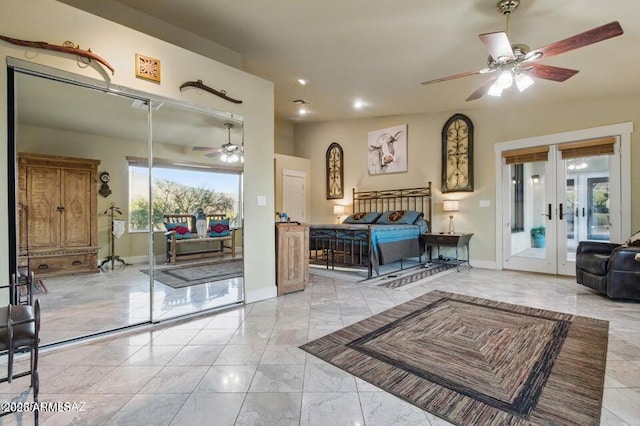 bedroom with baseboards, french doors, marble finish floor, and access to outside