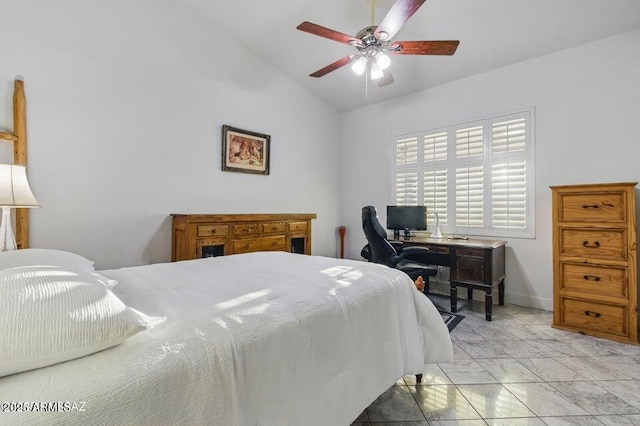 bedroom with lofted ceiling, a ceiling fan, and baseboards