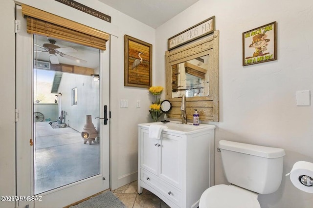 bathroom featuring a ceiling fan, vanity, and toilet