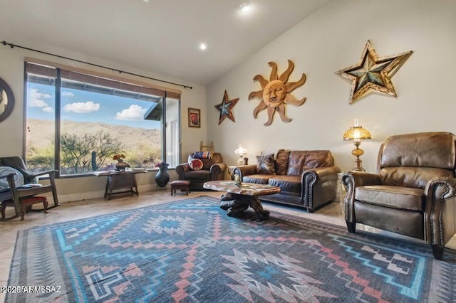 living room with lofted ceiling and recessed lighting