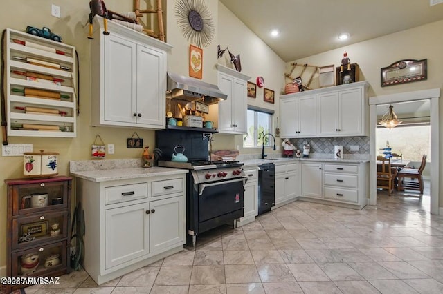 kitchen with exhaust hood, backsplash, a sink, gas range oven, and white cabinetry