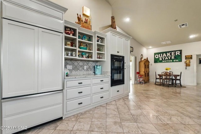 kitchen featuring dobule oven black, open shelves, decorative backsplash, marble finish floor, and visible vents